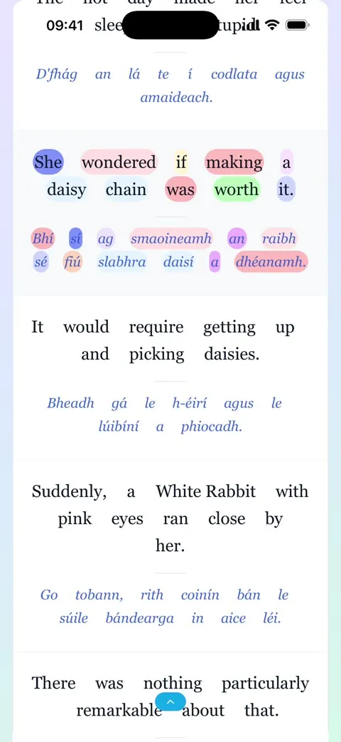 Linglow reading Alice in Wonderland in Irish. “She wondered if making a daisy chain was worth it.” sits in coloured grammar pills, with the Irish “Bhí sí ag smaoineamh an raibh sé fiú slabhra daisí a dhéanamh.” underneath in matching colours, and the rest of the page below in English and Irish.
